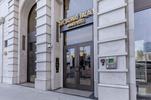 A building entrance with a sign reading 'Broadway Palaces Apartments.' - Cozy, stylish and vibrant Downtown Los Angeles home available for Sept 1-30 (Los Angeles)