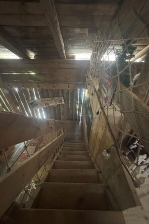 A wooden staircase with a metal railing, leading upwards. - La Chotte du Musher, (Champery), by Interhome (Champery)