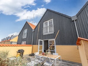 A modern two-story residential building with a dark exterior, a tiled roof, and a balcony. - "Ehlin" - 900m from the sea by Interhome (Skagen)