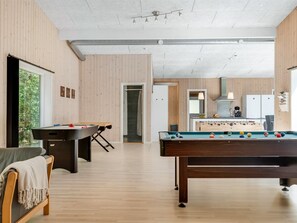 A modern indoor recreational area with a pool table, foosball table, and a seating area with a sofa and table. - "Nakke" - 900m from the sea by Interhome (Hadsund)