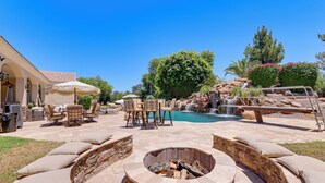 A backyard with a fire pit, outdoor seating, a swimming pool, and a waterfall feature. - 3 Mi to Dtwn Gilbert! Apt w/ Shared Poolside Oasis (Gilbert)