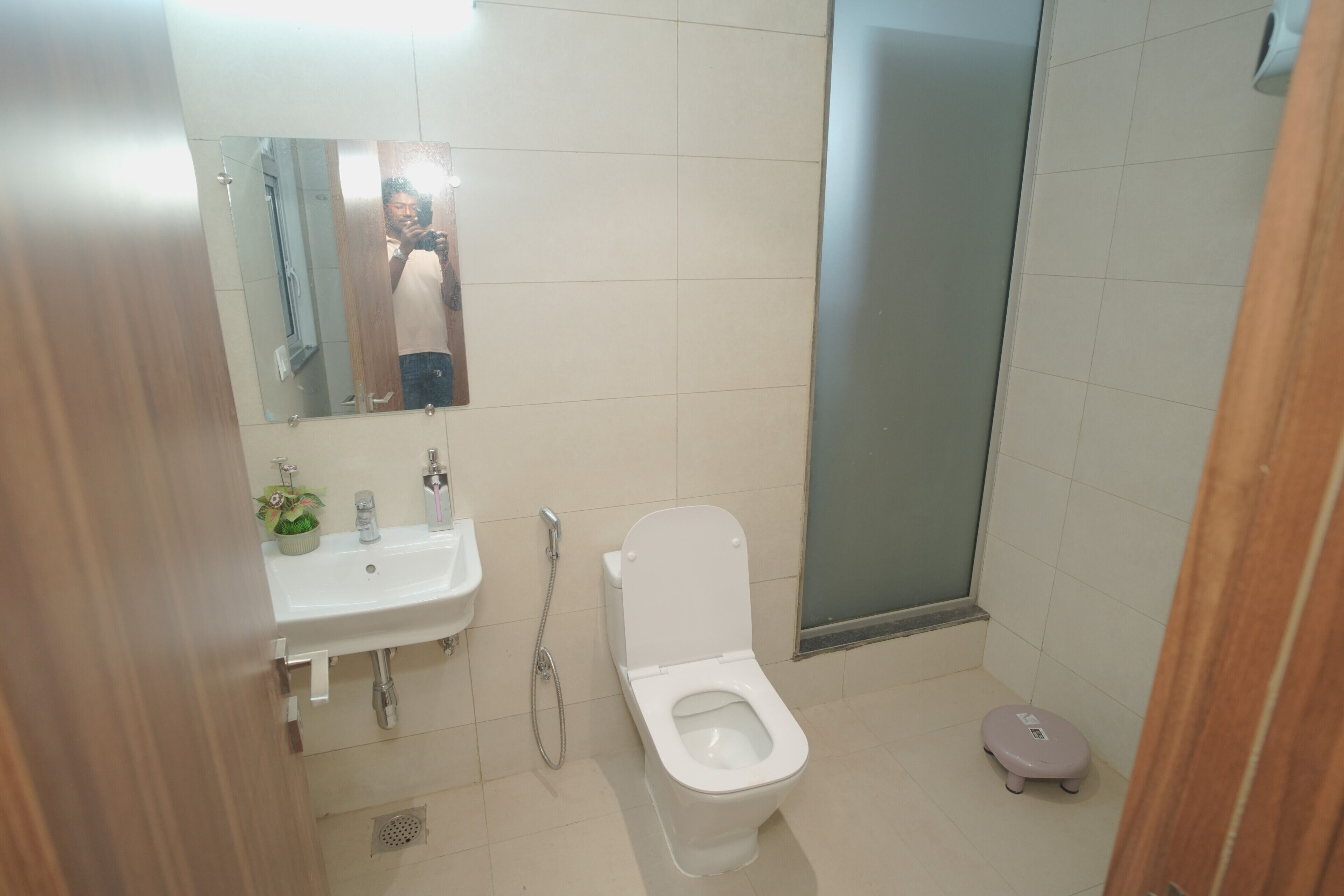 A bathroom with a sink, toilet, and shower.