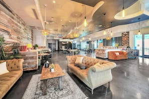A spacious lobby with a high ceiling, multiple seating areas, and a reception desk. - Sun, Sand & Gulf Views | End of Summer 15% off (Destin)