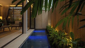 A modern interior with a water feature, indoor plants, and a seating area. - Holiday 3-Bedroom Delightful Villa @ Phan Thiet (Phan Thiết)