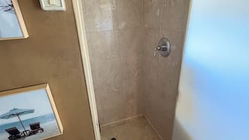 Shower, towels, soap, toilet paper