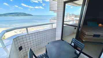 Deluxe Apartment, Balcony, Beach View | Outdoor dining