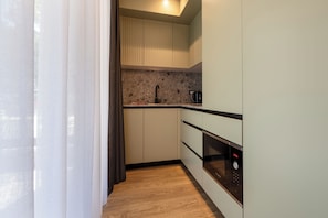 Estudio Deluxe, balcón | Cocina privada