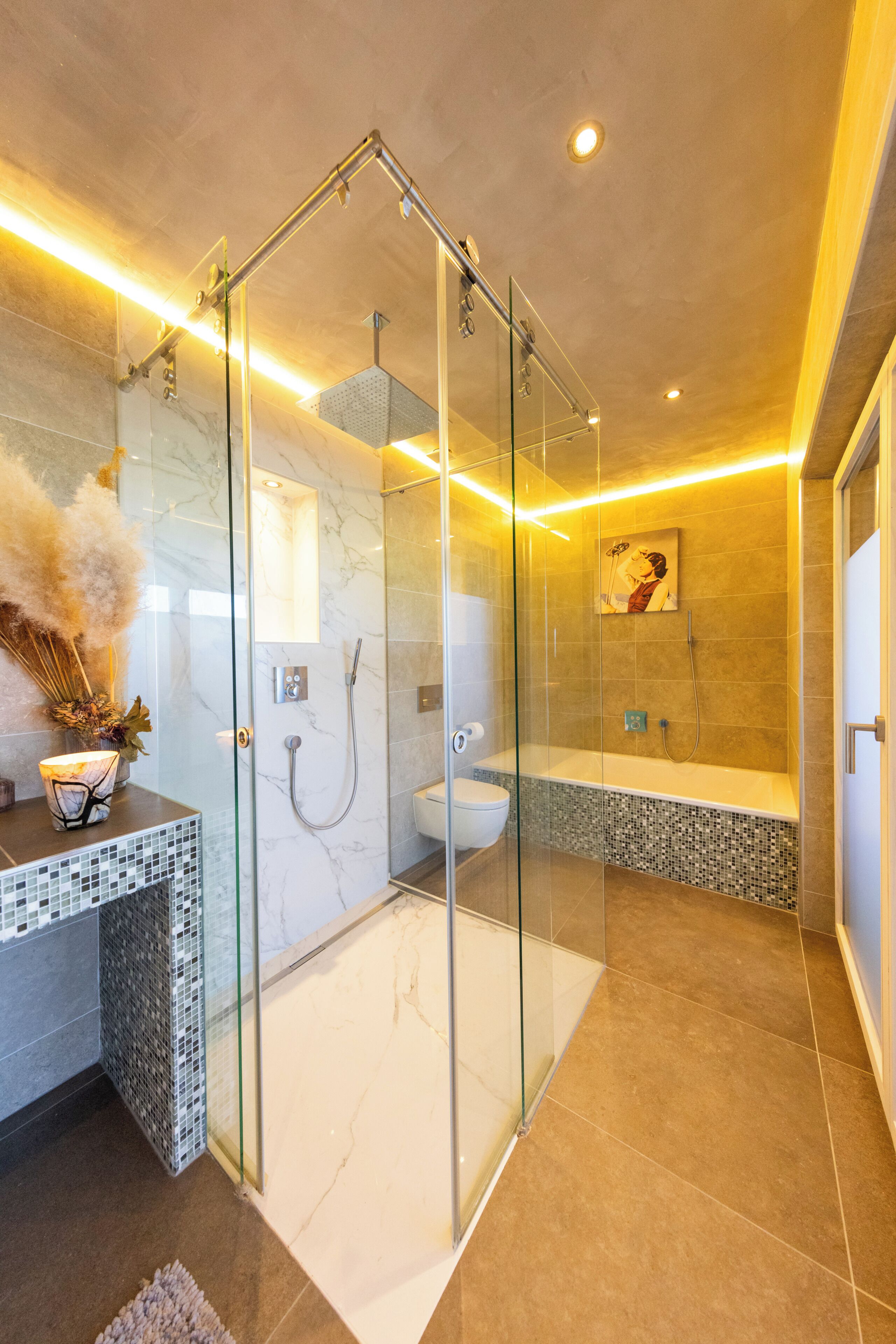 A modern bathroom with a glass-enclosed shower, a toilet, and a bathtub.