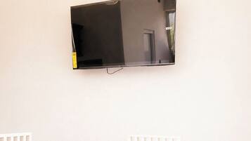 Deluxe Suite | Living area | 32-inch Smart TV with digital channels