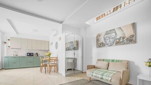 A modern living space with a kitchen, dining area, and a sofa. - ZU12/4 Spacious and bright apartment in Milan (Milano)