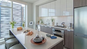 Coffee/tea maker, fridge, microwave, oven