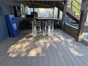 An outdoor patio with a grill, bar stools, and a pool table. - Private Pool Retreat, Fire Pit, Game Room (Oak Grove)