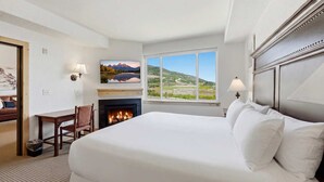 A hotel room with a large bed, a fireplace, a desk, and a view of a landscape. - New Listing Canyons Resort, Silverado, Pool, Golf! (Park City)