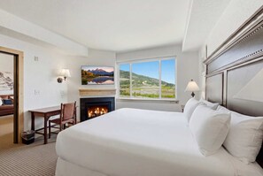 A hotel room with a large bed, a fireplace, a desk, and a view of a landscape. - New Listing Canyons Resort, Silverado, Pool, Golf! (Park City)