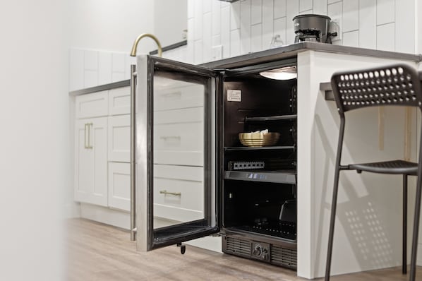 Coffee/tea maker, fridge, microwave, paper towels