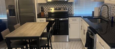 Coffee/tea maker, fridge, microwave, oven