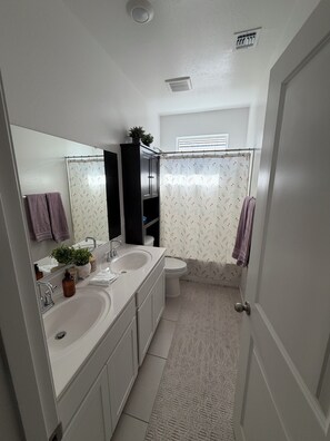 Shower, towels, soap, toilet paper