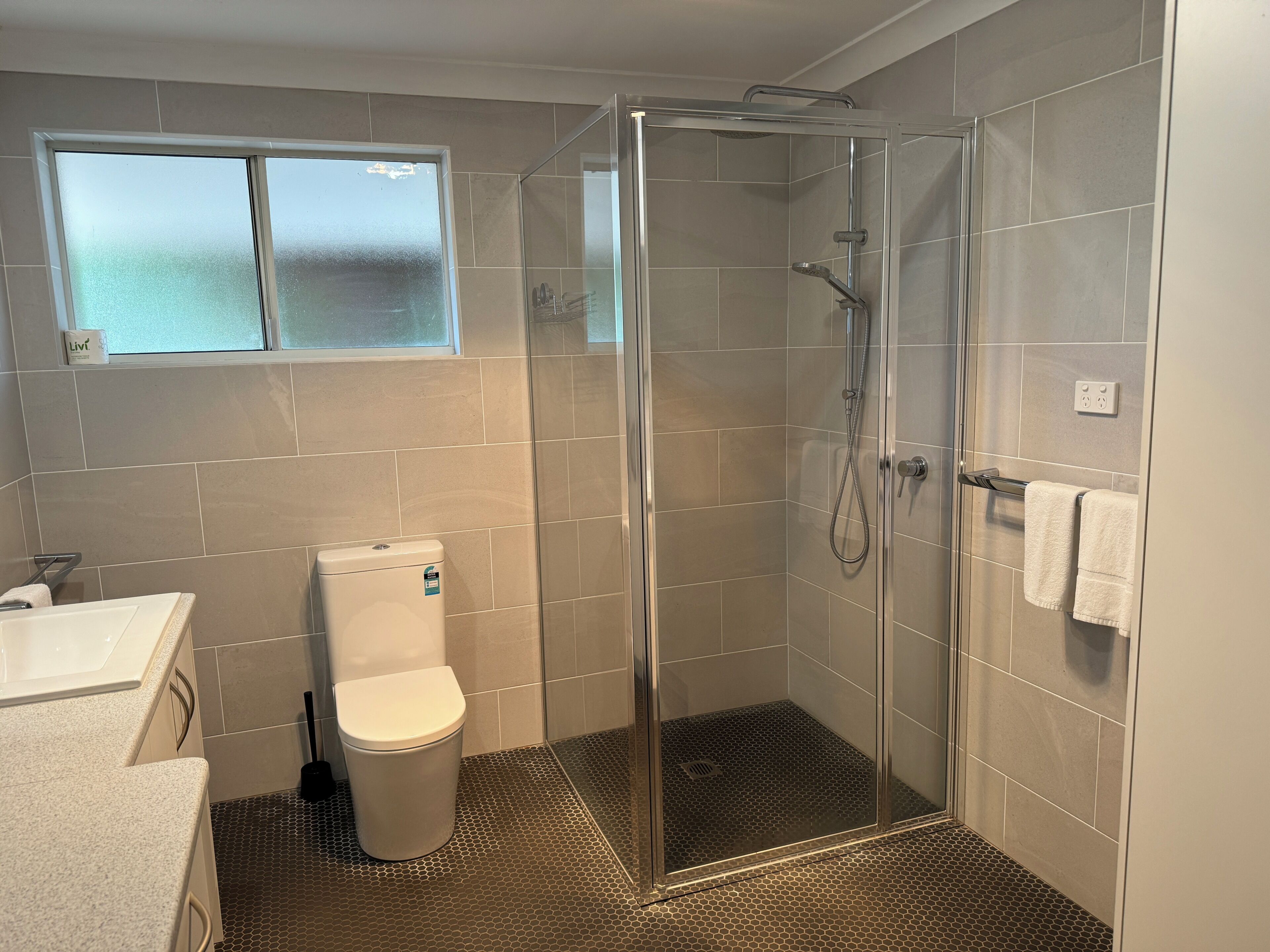 Shower, hair dryer, towels, soap