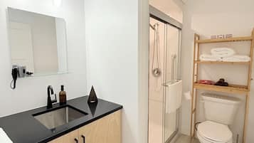 Shower, hair dryer, towels, soap