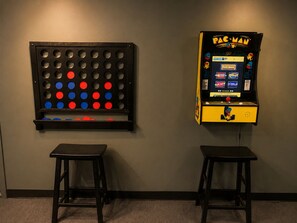 A Pac-Man arcade machine and a game of Connect Four on a wall. - Lake Access, Game Room, Close to Skiing, Sleeps 10 (Albrightsville)
