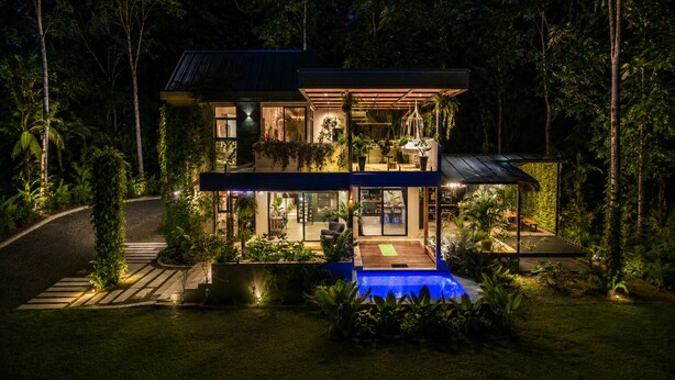 A modern two-story house with a swimming pool, surrounded by lush greenery. - Con Amor Caribe · 2,500 sq ft · Jungle Villa · Wildlife at Your Door ·Near Beach (Manzanillo)