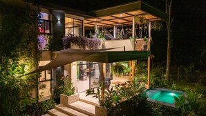 A modern house with a pool, outdoor seating, and lush greenery. - Con Amor Caribe · 2,500 sq ft · Jungle Villa · Wildlife at Your Door ·Near Beach (Manzanillo)