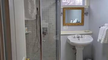 Shower, towels, soap, toilet paper