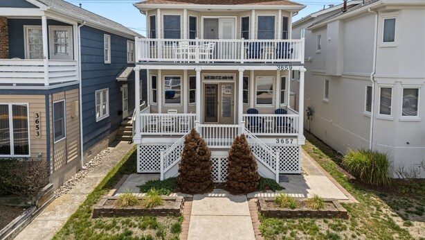 A two-story house with a front porch, two visible windows on the upper floor, and a mailbox. - Pet Friendly/ Top-Floor 3BR Retreat -Near Beach & 34th St (Ocean City)