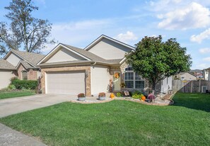 A residential house with a garage, a front yard with a tree, and a brick driveway. - Convenient Central Ky home in Georgetown, 11 mins to Horse Park (Georgetown)