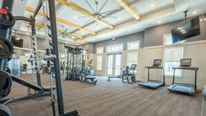 A gym with various exercise equipment, including weight machines and treadmills. - Landing | Incredible 2BD, Gym (St. Augustine)