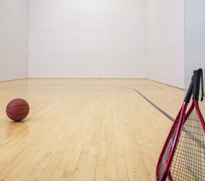 A room with a wooden floor, a basketball, and a tennis racket. - Cozy vacation get a way located in serene Vail.  Skiing and hiking. Sleeps 10 (Vail)