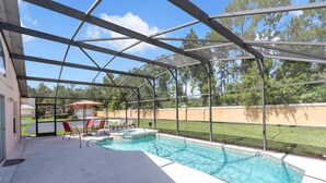 A covered outdoor swimming pool with a view of a residential area and trees. - Beautiful 4bdr With Private Pool Gated Community (Almont)