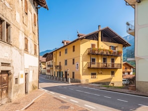 A street view with buildings, a clear sky, and a mountain in the background. - Ca' Alma Dolomia by Interhome (Strembo)