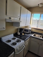 Suite estudio Confort, varias camas, no fumadores, microondas | Cocina privada | Frigorífico pequeño, microondas y trona infantil