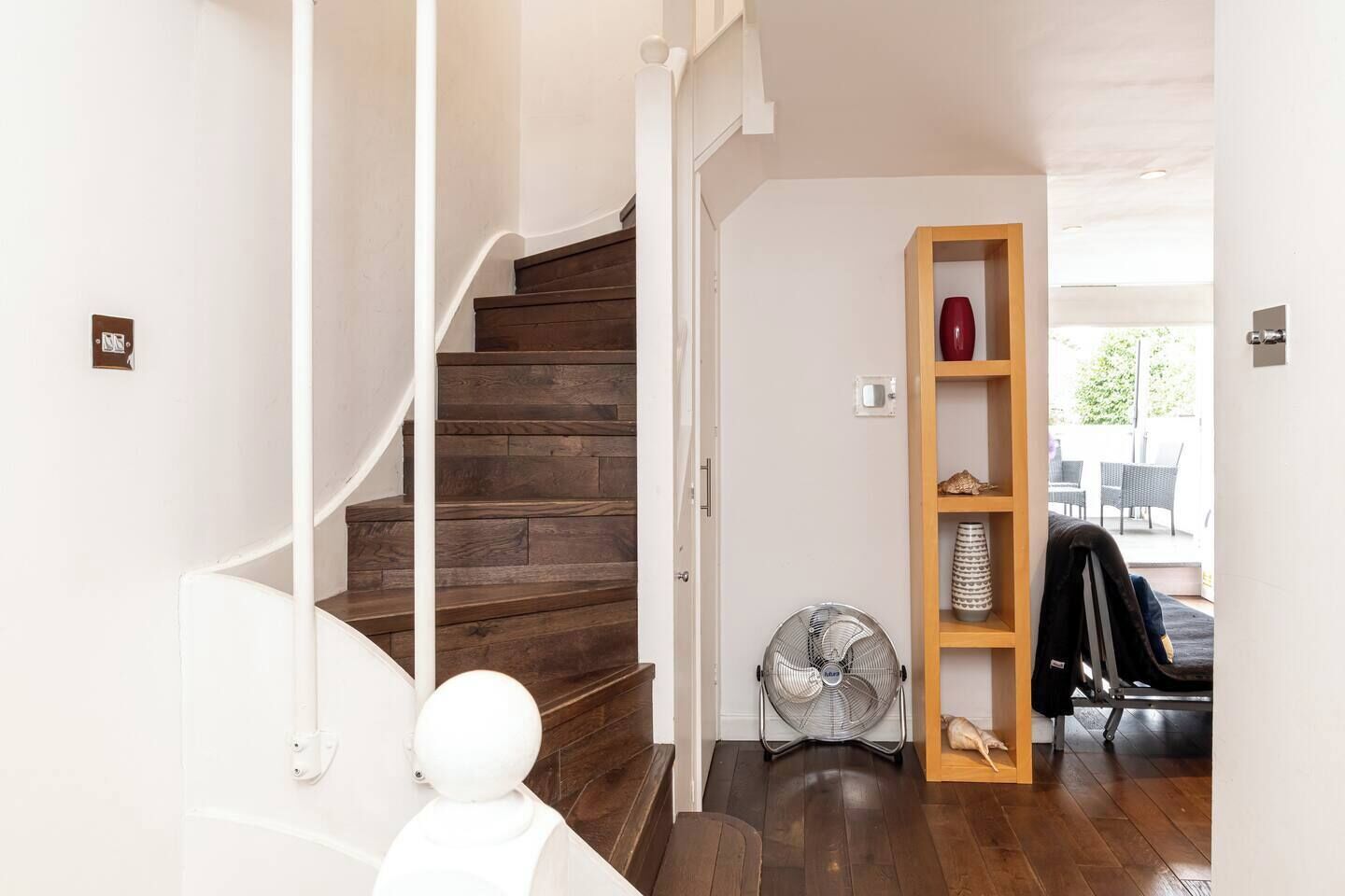 A staircase with wooden steps leading to a landing.