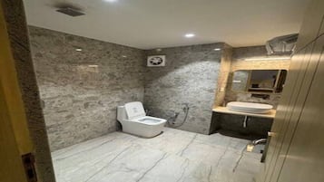 Shower, towels, soap, toilet paper