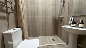 Standard Single Room | Bathroom | Shower, towels, toilet paper