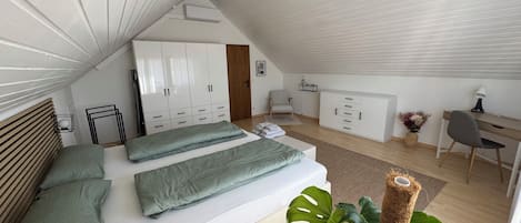 1 bedroom, desk, iron/ironing board, travel crib