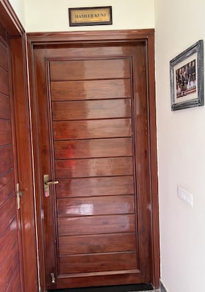 A wooden door with a nameplate above it. - Hadendra Residences - A Boutique Homestay in Jaipur (Jaipur)