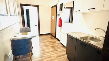 Mini-fridge, microwave, cookware/dishes/utensils