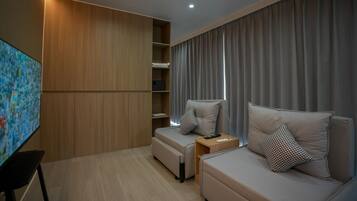 Suíte júnior, vista para a praia | Roupas de cama premium, cofres nos quartos, quartos à prova de som