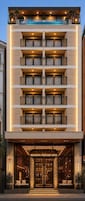 A multi-story hotel with a pool on the top floor, a grand entrance, and multiple balconies.