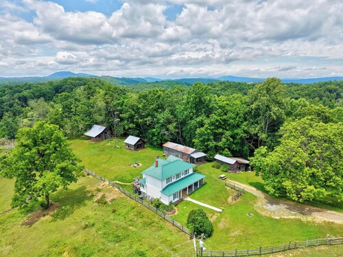 Escape to this spacious countryside retreat featuring beautiful mountain views, a wraparound porch.