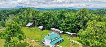 Escape to this spacious countryside retreat featuring beautiful mountain views, a wraparound porch.