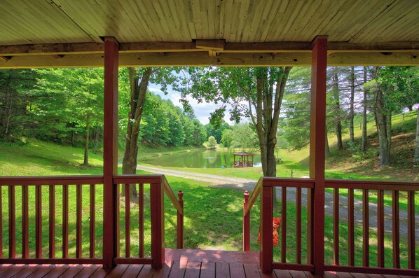 Property grounds - Cozy lakeside cabin with peaceful views, a covered porch, fire pit, and private rural getaway. (Galax)