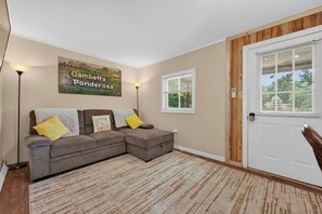 Living area - Cozy lakeside cabin with peaceful views, a covered porch, fire pit, and private rural getaway. (Galax)