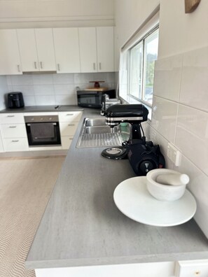 Private kitchen - Beach side Apartment, situated just across the road from Tathra’s main beach (Tathra)