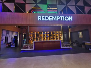 A store named 'REDEMPTION' with a display of various items.