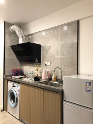 Refrigerator (on request), stovetop, cookware/dishes/utensils