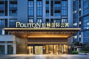 A modern building with a sign reading 'POLITON SERVICE APARTMENT'. - Poltton International Apartment (Guangzhou Design Capital, Jiahewanggang Metro Station) (Guangzhou)